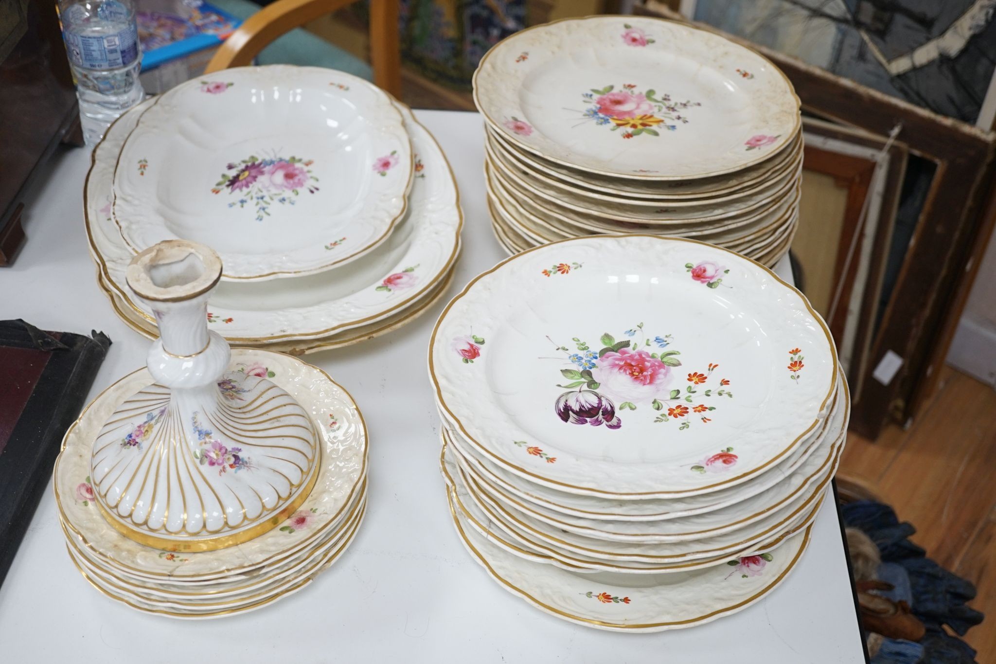 A 19th century floral painted part dinner service